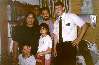 Myself with Bishop Pintos and his family. Only he seems to have turned out well in this photo
