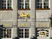 The sign over The Golden Unicorn (or literally, "To the Golden Unicorn"), a restaurant in the Aachen town square.