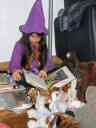 Xandie the good witch reads Halloween stories to her animal friends.