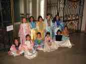 Xandie and her friends pose in their dress-up outfits during Xandie's birthday party.  Front row, L to R: Isobel, Aime, Isla, Xandie, Laura, Katherine.  Back row: Valerie, Sonakshi, Kathy, Fleur, Vivian.