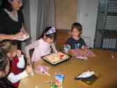 Xandie blows out candles at her birthday party.  From left: Laura, Aime, Pat, Xandie, Isobel.