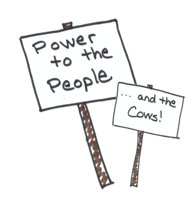 protest signs reading power to the people and the cows