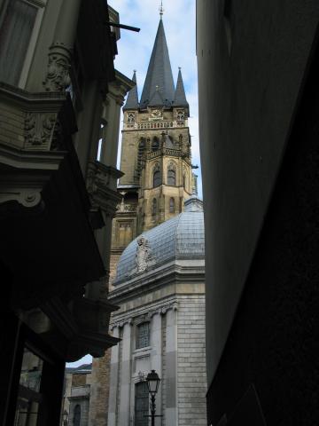 The tower of the cathedral in Aachen, viewed from a narrow alley.