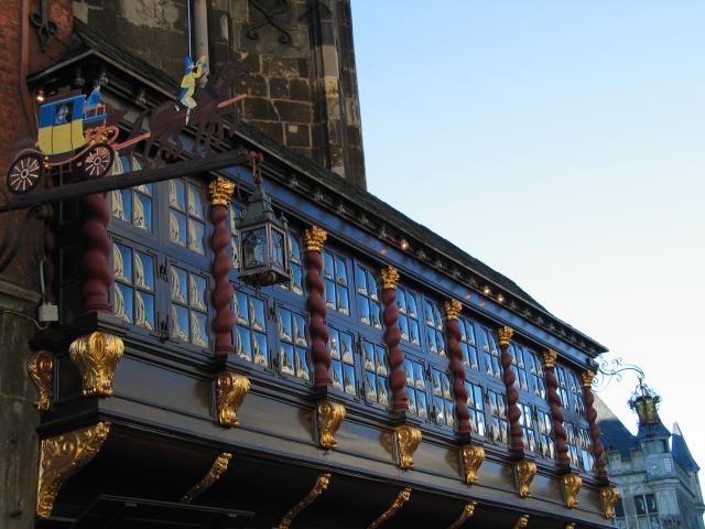 The ornately decorated facade over a Gasthaus (i.e., pub) in Aachen.