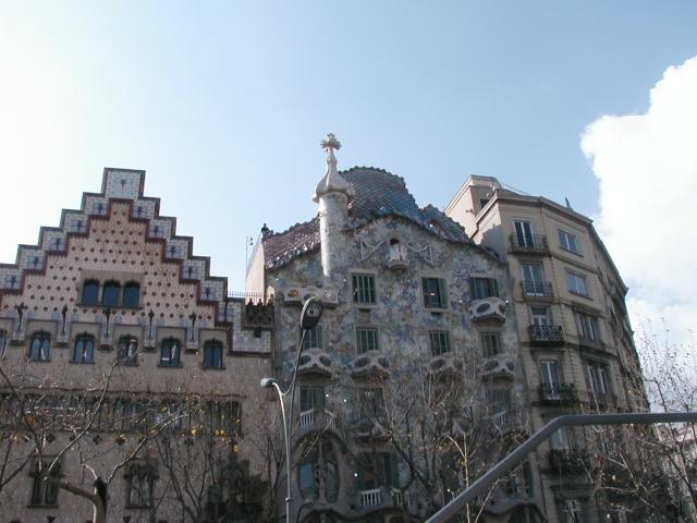 An architectural clash in Barcelona.  The middle building was designed by Gaudi.  Photo by Pat.