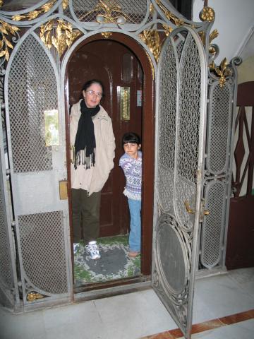 Pat and Xandie try out the Victorian-era elevator in our Barcelona hotel.  The elevator could hold all three of us, but not with luggage.  Xandie loved playing elevator operator.