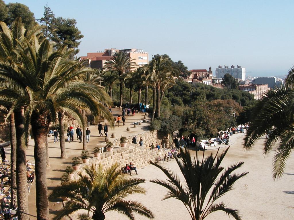 A view of the Parc Guell plaza, showing two different Gaudi-designed walls; the serpentine wall is to the right.  Photo by Pat.