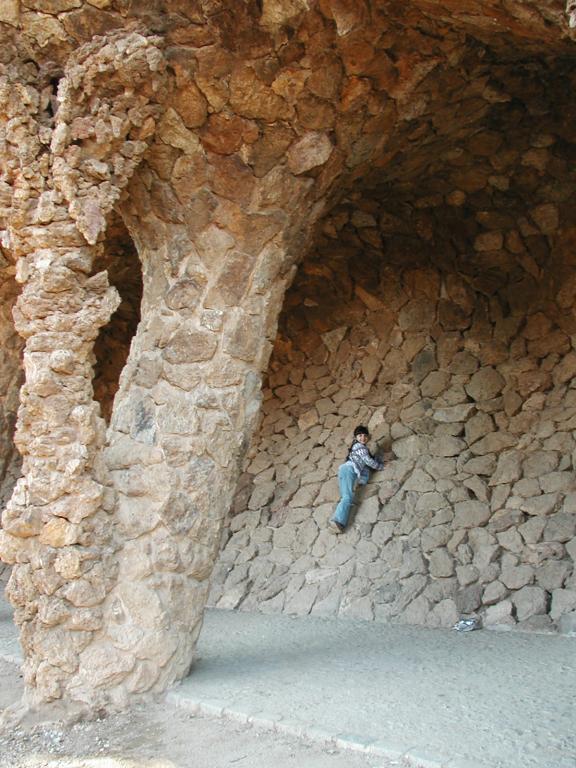 Xandie climbs an oddly inclined wall at Parc Guell.  Photo by Pat.