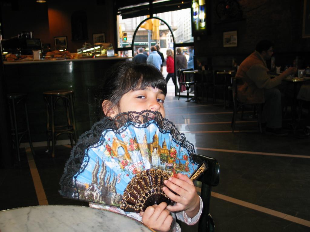 Xandie shows off the Spanish fan she picked up in Parc Guell.  The guy was selling them from 2 Euros each, or 3 Euros for 2.  Xandie walked up, showed him the remaining 1.50 from her allowance, and looked cute.  That was all it took!