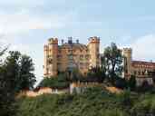 Hohenschwangau Castle, where "Mad" King Ludwig II grew up,
photographed from the path to Neuschwanstein Castle, which Ludwig
built to use as his primary residence but lived in for only about 70
days before his untimely death.  Photo by Xandie.