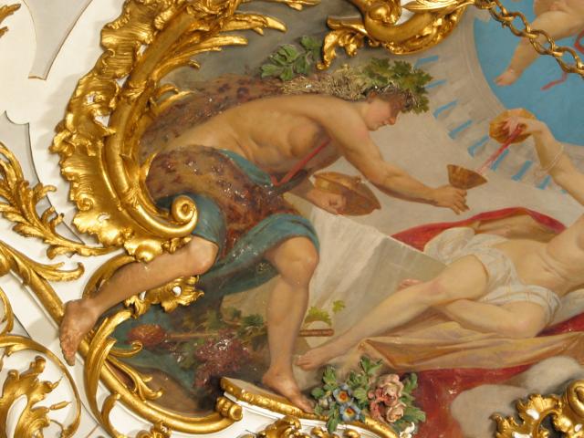 A ceiling painting in Schlo Linderhof.  Note that the man's leg is
three-dimensional, coming out of the painting toward the viewer.  This
technique is characteristic of the rococo style that was used in
constructing the palace.
