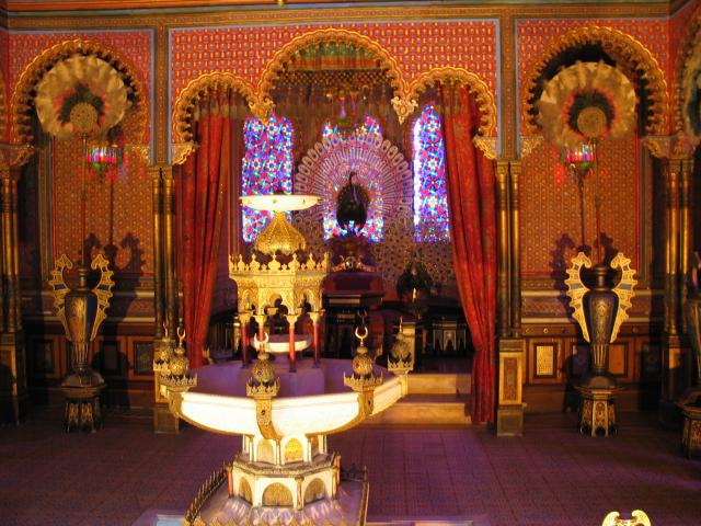 Interior of the "kiosk" at Schlo Linderhof.  I got great mileage out
of Ben FrantzDale's design for a camera hood, because the interior was
behind a glass partition and the light was very low.  Here, you can
see the throne with the elaborate peacocks above and around it.