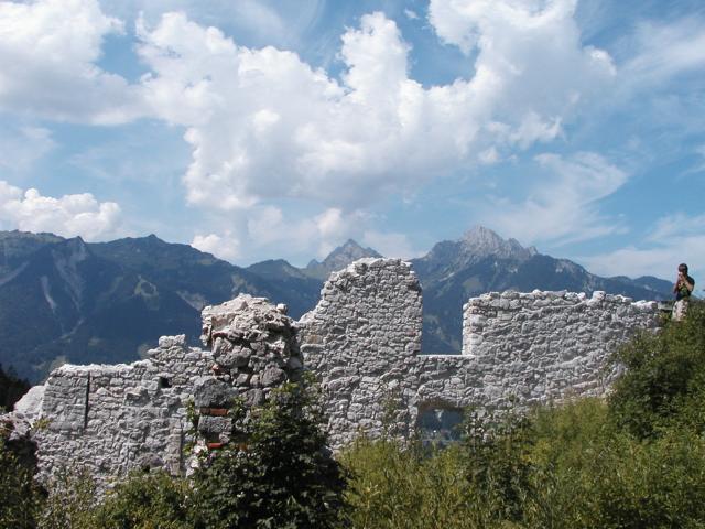 A wall at the Ehrenberg ruins, showing the view of the mountains
across the valley.  You can clearly see the contrast between the
original parts of the wall and the rebuilt portions.  I suspect that
the line of the window wasn't nearly as clean in 1650.  Photo by
Xandie.