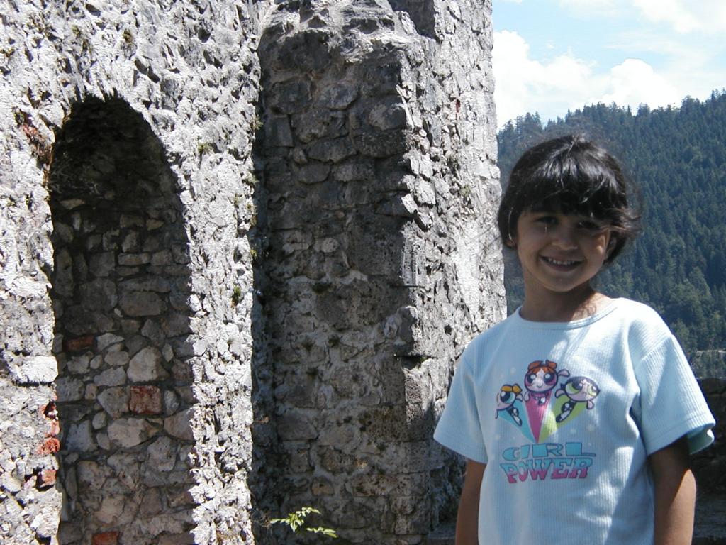 Xandie in front of original arches at the Ehrenberg ruins.  Note the
contrast between the rough stonework and the neatness of the rebuilt
sections shown in other pictures.  Photo by Pat.