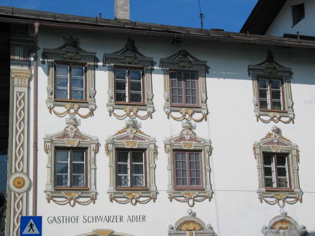 Typical Bavarian wall painting on a Gasthof in Reutte-in-Tirol.  Note
that two of the windows are entirely painted, and all of the
decorative frames are clever illusions.
