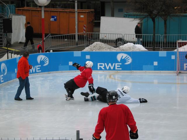 Ice soccer in Essen.  When one falls, everything deteriorates.