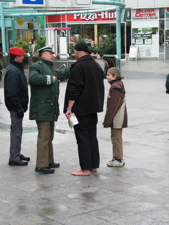 A citizen of Essen asks directions of two policemen.  It's January 22nd; do you see anything wrong with this picture?