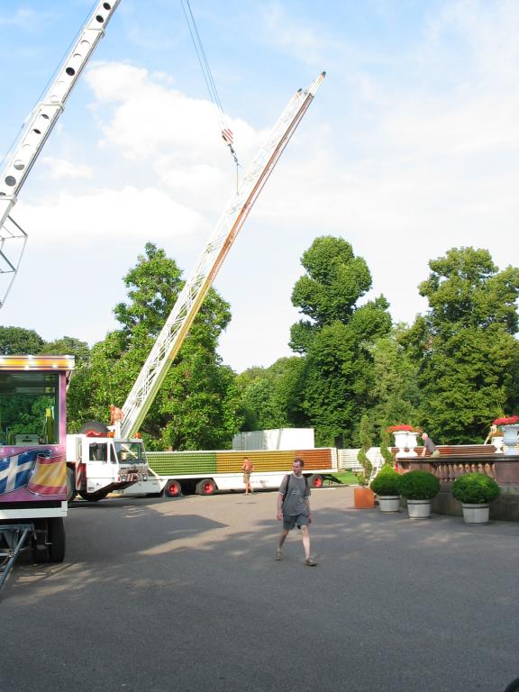 Stacking the ribs on the truck.  There are two trucks carefully lined
up with each other.  The ribs are bolted to the first truck, then
lowered, and split in half.  The upper part is then re-lifted and
stacked on the second truck.