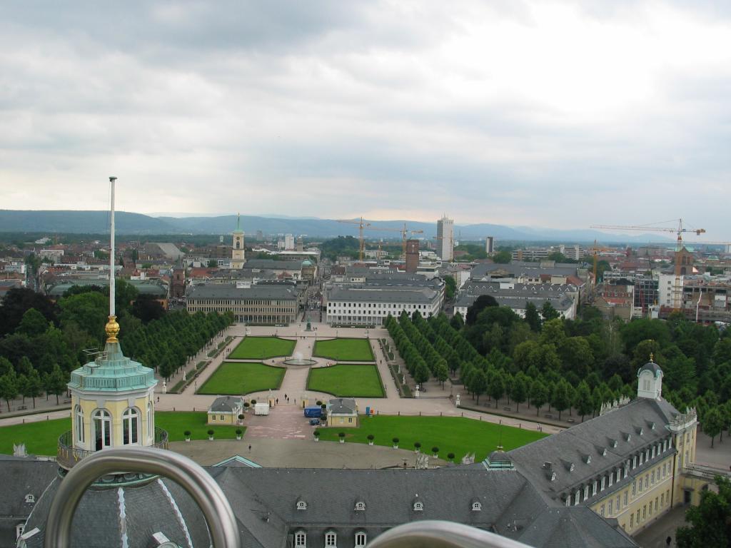The Karlsruhe palace, the front palace grounds (which is the small
part), and the city of Karlsruhe, all viewed from the top of the giant
Ferris wheel that was set up behind the palace when we arrived.  Just
outside the grounds are two white buildings; our apartment is in the
right-hand one.