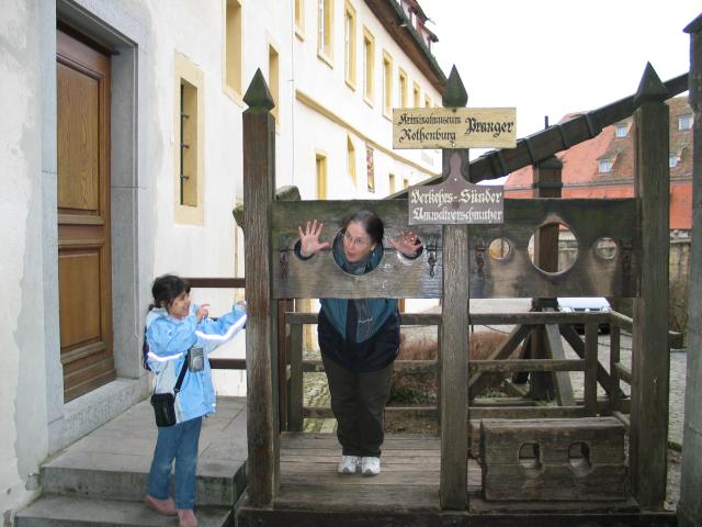 Xandie chastises Pat, who is being punished for severe misbehavior by being placed in the stocks outside the Rothenburg Medieval Crime Museum.  I forget her exact crime, but I'm sure it had to do with chocolate.