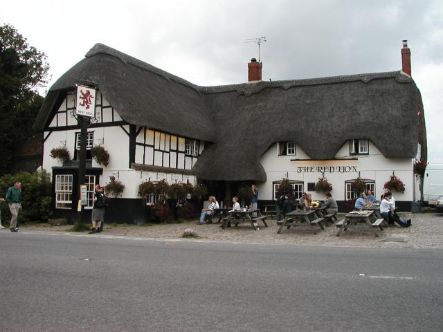 The "Red Lion" in Avebury, where we stopped for a pint after visiting
the stone circle.  Note the traditional thatched roof.  If you look
closely, you can spot Pat at one of the tables on the right.  Photo by
Xandie.