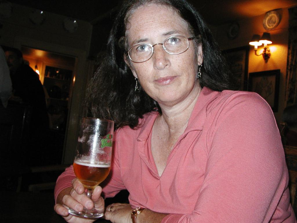 Pat enjoying a pint in her grandfather's favorite pub.  Photo by
Xandie.