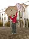 Xandie dodging raindrops in the International Department courtyard.