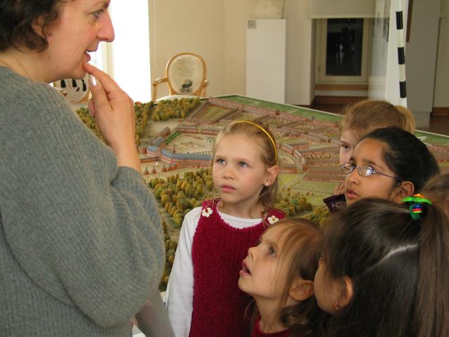 Attendees at Xandie's birthday party listen to their tour guide. L to R: Guide, Valerie, Aime, Kathy, Katherine, Sonakshi.