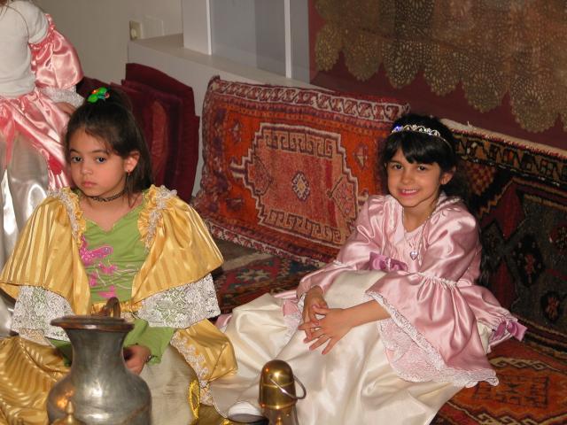 Kathy and Xandie sit for "tea" in their dress-up outfits at Xandie's birthday party.