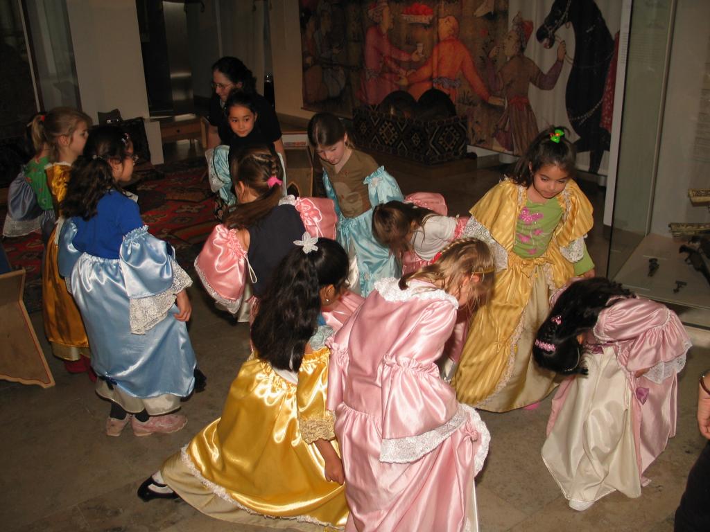 Xandie and her friends curtsy to each other while dancing a polonaise at Xandie's birthday party.  L to R: Katherine, Vivian, Pat, Laura, Isobel, Sonakshi, Fleur, Aime, Valerie, Kathy, Xandie.