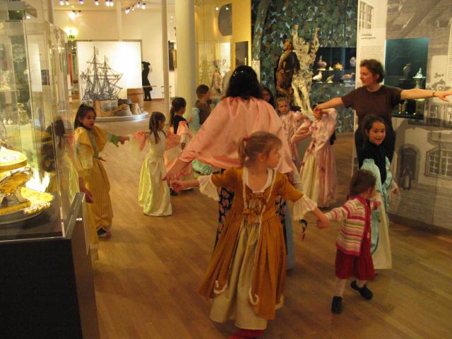 Xandie and her friends dance a polonaise at Xandie's birthday party. Clockwise from L: Kathy, Aime, Isobel, Fleur, Pat, Vivian, Valerie, Xandie, guide, Laura, three-year-old who wanted to join in, Katherine.