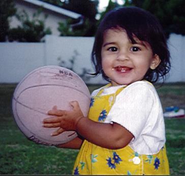Holding a basketball
