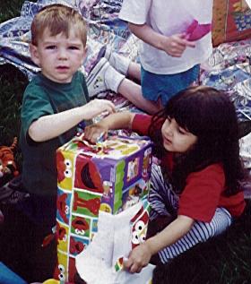 Ben helps
	  Xandie open a present