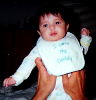 With an 'I love my Daddy' bib