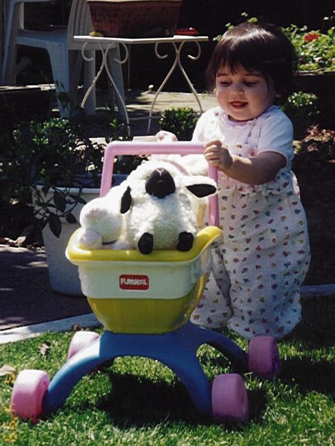 Giving her lamb a ride