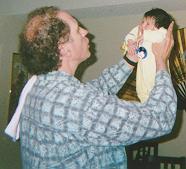 Geoff flies Alexandra around the room