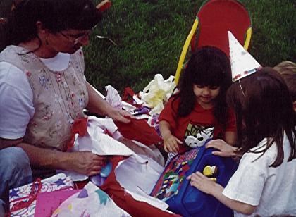 Xandie
	  opening a bunch of Legos
