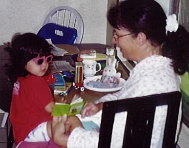 Reading to Mommy in sunglasses