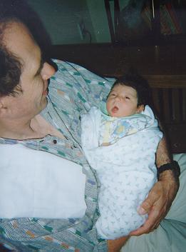 Sticking out her tongue at her father