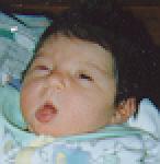 Sticking out her tongue