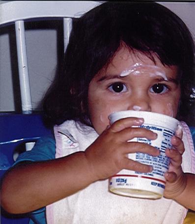 Drinking from a yogurt cup